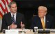 US President Donald Trump listen to US Secretary of Treasury Scott Bessent