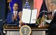 US President Donald Trump displays an executive order on artificial intelligence