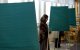 A Muslim woman casts her vote at a polling station during general elections in Stockholm in 2010
