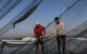 Palestinian fishermen retrieve their catch on the beach in the central Gaza Strip