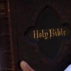A man holds an Holy Bible while Pope Francis from the window of the Apostolic palace delivers the blessing on February 21 2021 overlooking the faithful in the St.Peter's square in Vatican.
Faithful are still allowed in Saint Peter square in limited numbers and wearing masks due to the rules against Covid-19 pandemic spread. (Photo by Giuseppe Fama/Pacific Press)