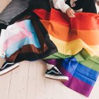 Two children play with the trans and LGBT flags.