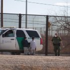 Two immigrant children surrendered to a border patrol agent after crossing the Rio Grande