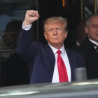 Former President Donald Trump gestures with a fist before leaving Trump Tower, Tuesday, April 4, 2023 in New York after to face charges related to hush money payments.