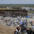 Migrants stuck between the primary and secondary fencing at the Tijuana-San Diego border