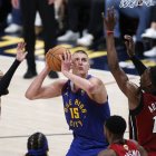 Denver Nuggets center Nikola Jokic (15) goes to the basket.