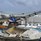 Damaged fishing boats rest on the shore after the passing of Hurricane Beryl at the Bridgetown Fish Market, Bridgetown, Barbados on July 1, 2024. (Photo by Randy Brooks / AFP)