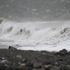 High waves crash along the beach in Kingston, Jamaica, before the arrival of Hurricane Beryl on July 3, 2024. - Beryl churned towards Jamaica on July 3, with forecasters warning of potentially deadly winds and storm surge, after at least seven people were killed and widespread destruction was reported across the southeastern Caribbean. The powerful hurricane, which is rare so early in the Atlantic season, was expected to pass over Jamaica around midday as a "life-threatening" Category 4 storm, meteorologists said. (Photo by Ricardo Makyn / AFP)