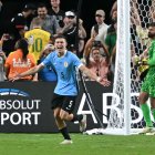 Uruguay's midfielder #05 Manuel Ugarte celebrates after scoring in a penalty shoot-out to win the Conmebol 2024 Copa America tournament quarter-final football match between Uruguay and Brazil at Allegiant Stadium in Las Vegas, Nevada on July 6, 2024. (Photo by Frederic J. Brown / AFP)