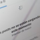 This photo illustration shows a screen with a message from the social network X (former Twitter) that says, "Posts are not loading at the moment. Try again" in Rio de Janeiro, Brazil, on September 2, 2024. - Brazil's Supreme Court on Monday ratified the decision by one of its judges to suspend Elon Musk's X social network for alleged judicial transgressions. (Photo by MAURO PIMENTEL / AFP)