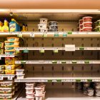 Butter and cheese shelves are seen empty at a supermarket in Miami Beach, Florida on January 13, 2022. The ongoing strains of the coronavirus pandemic have led to sickened workers and staffing shortages for crucial supply-chain functions such as transportation and logistics, which affect the delivery of products and restocking of store shelves. (Photo by CHANDAN KHANNA / AFP)
