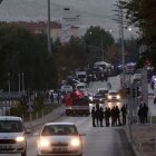 Turkish police officers secure part of the main road leading to the Turkish Aerospace Industries (TAI) building, after a huge explosion at these headquarters, in Kahramankazan, some 40 kilometers (25 miles) north of Ankara on October 23, 2024. - Four people were killed and 14 others wounded in an attack on the headquarters of a top Turkish defence firm TAI, near Ankara, Turkish officials said October 23. (Photo by Adem ALTAN / AFP)