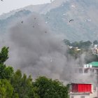 Smoke billows after an artillery shell landed in the main town of Poonch district in India's Jammu region on May 7, 2025. At least eight Indians were killed and 29 others wounded Wednesday in the town of Poonch in Kashmir, close to the de facto border with Pakistan, a local Indian government official said. (Photo by Punit PARANJPE / AFP)