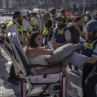 Israeli paramedics assist a woman injured following an Iranian attack.