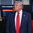 US President Donald Trump (C) looks on, alongside Attorney General Pam Bondi (L) and US Attorney for the District of Columbia Jeanine Pirro (R), during a news conference to discuss crime in Washington, DC, in the Brady Press Briefing Room at the White House in Washington, DC, on August 11, 2025. President Donald Trump announced Monday that he was deploying National Guard troops and putting the Washington police force under federal control to tackle crime in the US capital. "This is Liberation Day in DC, and we're going to take our capital back," Trump said at a White House press conference. (Photo by ANDREW CABALLERO-REYNOLDS / AFP)