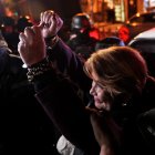 Former Bolivian interim President Jeanine Añez is escorted by police as she enters the Miraflores women's prison in La Paz on October 17, 2024. A court in La Paz rejected Thursday to prosecute former president Jeanine Áñez for allegedly having planned a coup d'état against Evo Morales in 2019, announced her lawyer Luis Guillén, at the end of the hearing for the case. (Photo by JORGE BERNAL / AFP)