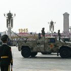 Military vehicles roll during a military parade marking the 80th anniversary of victory over Japan and the end of World War II, in Beijings Tiananmen Square on September 3, 2025. (Photo by GREG BAKER / AFP)