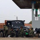 This handout picture released by the Colombian Interior Ministry shows Colombian soldiers taking up position during the liberation of soldiers who had been taken hostage in El Tambo, Cauca Department, Colombia, on June 23, 2025. On Monday, the Colombian army, with the help of the police, freed 57 soldiers who had been held since the weekend by residents of a region in the southwest of the country dominated by guerrillas and captured the "alleged kidnappers," authorities announced.