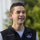 Inspiration4 mission commander Jared Isaacman, founder and chief executive officer of Shift4 Payments, speaks during an interview in front of the recovered first stage of a Falcon 9 rocket at Space Exploration Technologies Corp. (SpaceX) on February 2, 2021 in Hawthorne, California. Isaacman's all-civilian Inspiration4 mission will raise $200 million for St. Jude Children's Research Hospital through a donation based sweepstakes to select a member of the crew. (Photo by Patrick T. FALLON / AFP)
