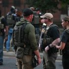 Federal police officers stand near a vehicle checkpoint (Files)