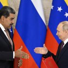 Russian President Vladimir Putin and Venezuelan President Nicolas Maduro shake hands as they exchange documents during a signing ceremony following their talks at the Kremlin in Moscow on May 7, 2025. (Photo by Alexander NEMENOV / AFP)