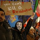 An anti-Iranian regime protester holds up a placard (Files)