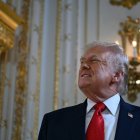 US President Donald Trump arrives to take part in a dedication ceremony for Southern Boulevard, in the ballroom at Mar-a-Lago in Palm Beach, Florida, on January 16, 2026. (Photo by ANDREW CABALLERO-REYNOLDS / AFP)