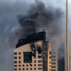 Smoke rises from a high-rise building following a drone attack in Kuwait City