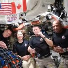 This screengrab from a NASA livestream shows Artemis II crew members Jeremy Hansen, Christina Koch, Reid Wiseman and Victor Glover speaking with US President Donald Trump via a call aboard the Orion spacecraft on April 6, 2026. Artemis astronauts at the outer edge of human space travel had an emotional moment April 6 as they named a crater in honor of the deceased wife of mission commander Reid Wiseman. "It's a bright spot on the Moon. And we would like to call it Carroll," Canadian astronaut Jeremy Hansen told a live broadcast. The crater can be seen "at certain times of the Moon's transit around Earth," he said. (Photo by Handout / NASA / AFP) / RESTRICTED TO EDITORIAL USE - MANDATORY CREDIT "AFP PHOTO / NASA" - HANDOUT - NO MARKETING NO ADVERTISING CAMPAIGNS - DISTRIBUTED AS A SERVICE TO CLIENTS