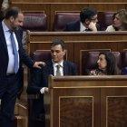 Socialist MP's Jose Luis Abalos Pedro Sanchez (L) greets the leader of Spanish Socialist Party PSOE, Pedro Sanchez during a no-confidence motion tabled by Spanish Socialist party at the Lower House of the Spanish Parliament in Madrid on May 31, 2018. Spanish Prime Minister Mariano Rajoy faces a no-confidence vote at the end of the week after a court ruled his governing Popular Party benefited for years from a large kickbacks-for-contracts scheme. (Photo by OSCAR DEL POZO / AFP)