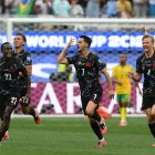 Los jugadores canadienses celebran la clasificación ante Sudáfrica/ Patrick T. Fallon