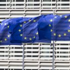 Flags of Europe as seen waving from the flagpoles in front of the EU Commission headquarters.