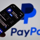 Offer available: Paypal is apparently up for sale. A smartphone displays the PayPal app in the App Store in front of a blurry monitor with the PayPal logo ?SVEN SIMON Photo Agency GmbH & Co. Press Photo KG # Seidlhofstr.10 # 85540 Haar # GLS Bank IBAN (Photo by Frank Hoermann / SVEN SIMON / SVEN SIMON / dpa Picture-Alliance via AFP)