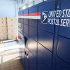 USPS Smart Lockers for package pickup stand in the lobby of the United States Postal Service (USPS)