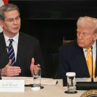 US President Donald Trump listen to US Secretary of Treasury Scott Bessent