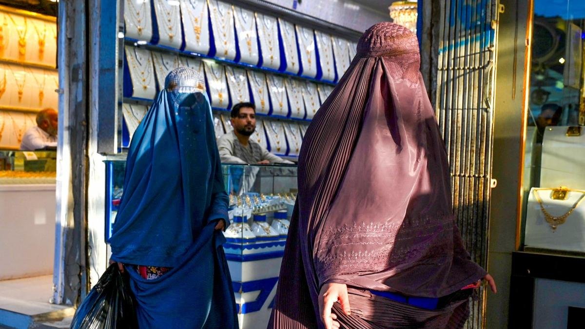 Two burqa-covered Afghan women in a Kandahar market