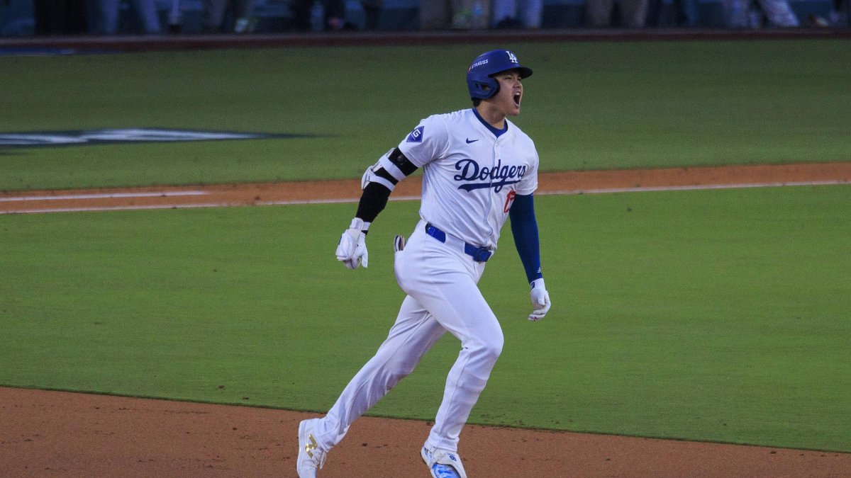 Ohtani runs after hitting a three-run home run in his MLB playoff debut.