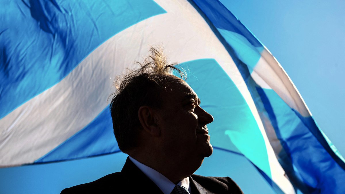 Alex Salmond poses with a Scottish flag.