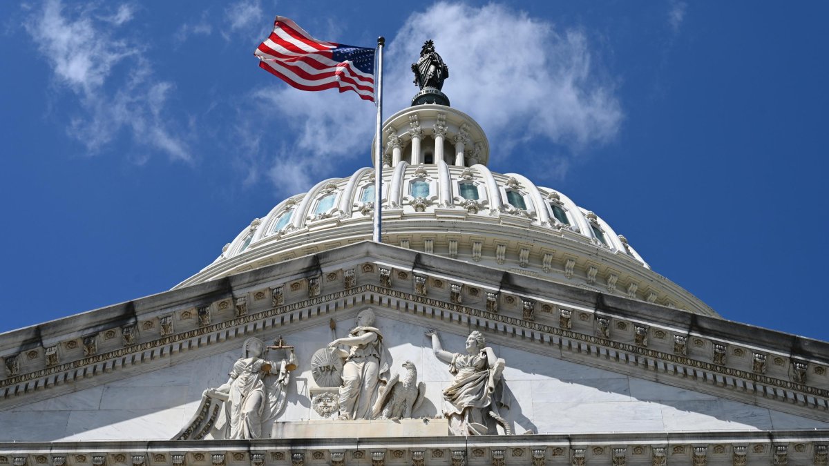 U.S. flag flying at full mast on Capitol Hill at Trump's inauguration.