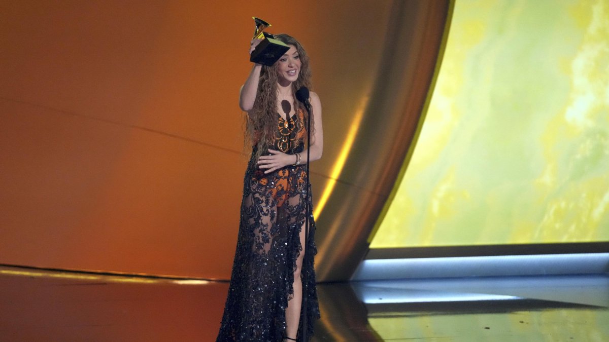 Shakira picks up the award for best Latin pop album for Las Mujeres Ya No Lloran during the 67th Grammy Awards.