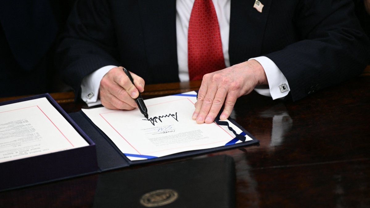 Trump, at the moment of signing the law ending the shutdown.