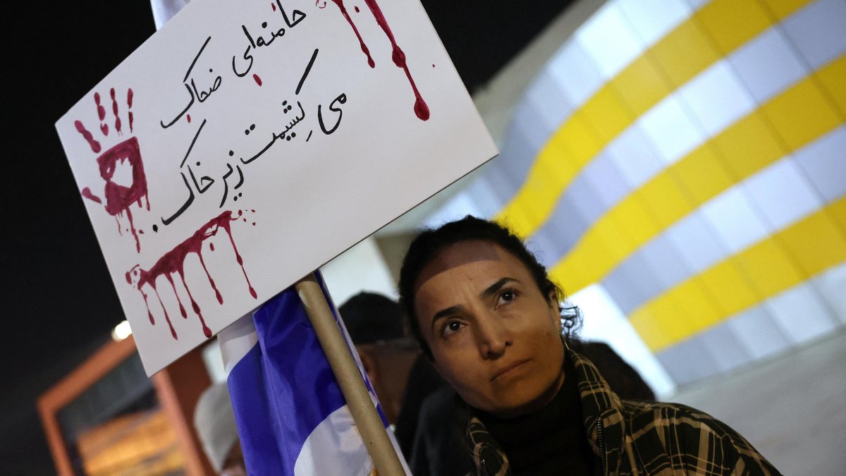 A woman protests in solidarity against the repression in Iran.