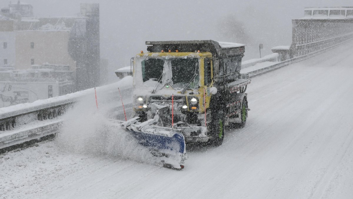 A snowplow on the Brooklyn Bridge