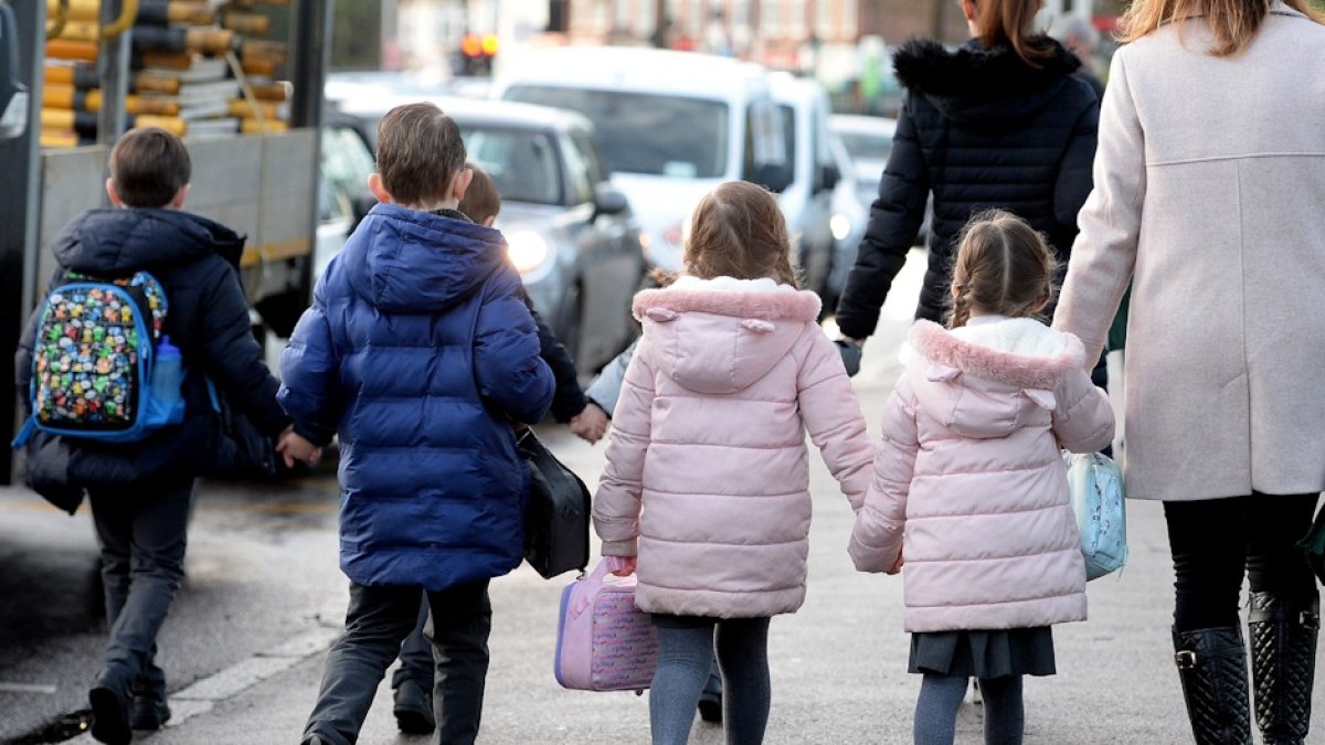 Children walking down a street.