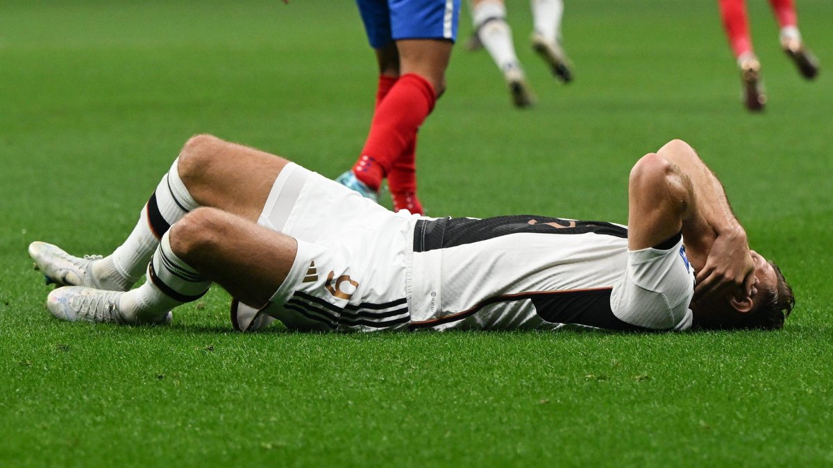 01 December 2022, Qatar, Al-Chaur: Soccer: World Cup, Costa Rica - Germany, preliminary round, Group E, Matchday 3, Al-Bait Stadium, Germany's Niclas Füllkrug lies on the pitch. Photo: Federico Gambarini/dpa