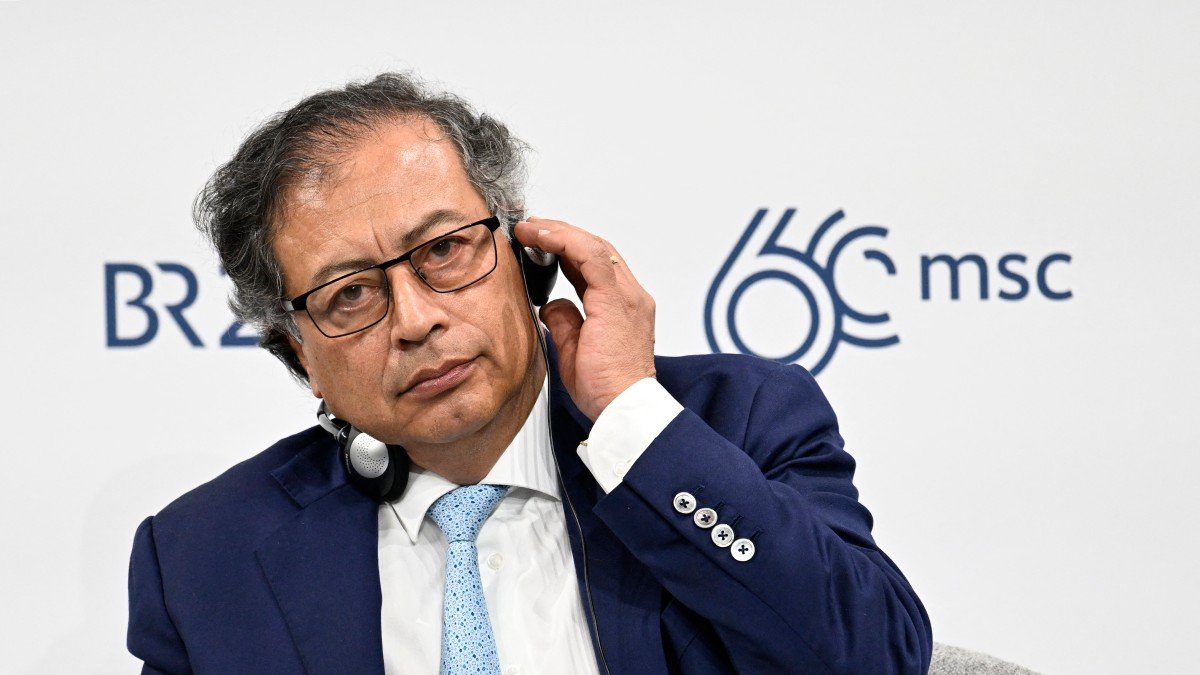 Colombian President Gustavo Petro Urrego adjusts his headset as he attends a roundtable discussion during the 60th Munich Security Conference (MSC) at the Bayerischer Hof Hotel in Munich, southern Germany on February 16, 2024. (Photo by THOMAS KIENZLE / AFP)