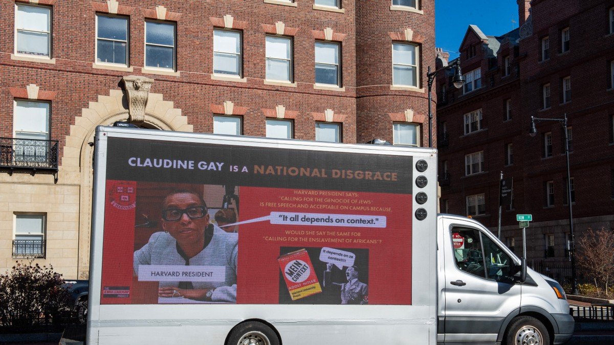 A truck calling the president of Harvard a disgrace drives around Harvard University in Cambridge, Massachusetts on December 12, 2023. - Harvard University's president, under fire over testimony she gave about anti-Semitism on campus, will remain in her job after a meeting of the institution's governing body issued a statement backing her on December 12, 2023. (Photo by Joseph Prezioso / AFP)