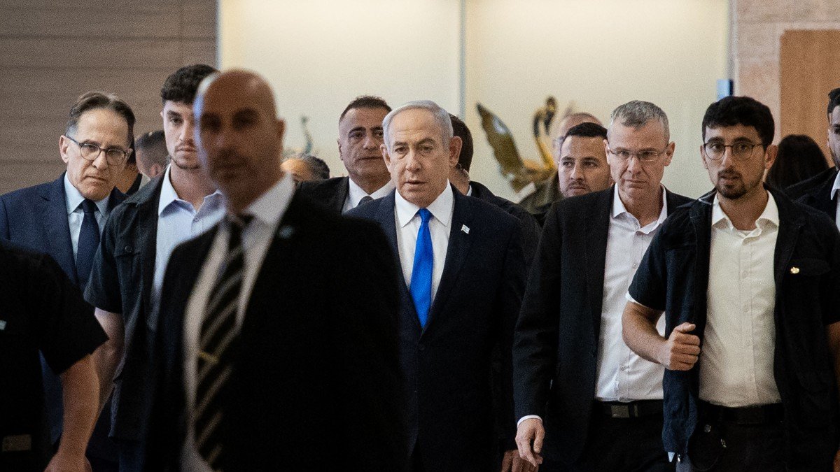 Israeli Prime Minister Benjamin Netanyahu (C) arrives for a party meeting at the Israeli parliament, the Knesset, in Jerusalem on May 20, 2024. - Israel on May 20 slammed as a 