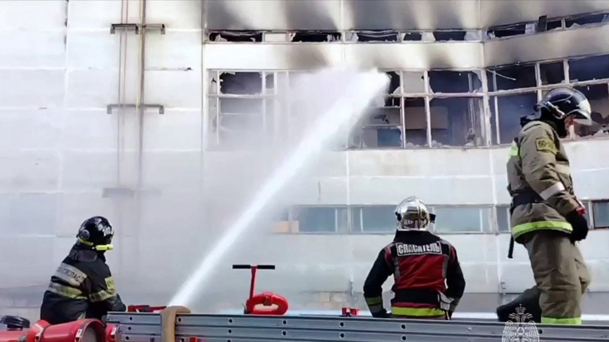Firefighters work to extinguish the fire at the Platan Research Institute building in Fryazino, Russia.