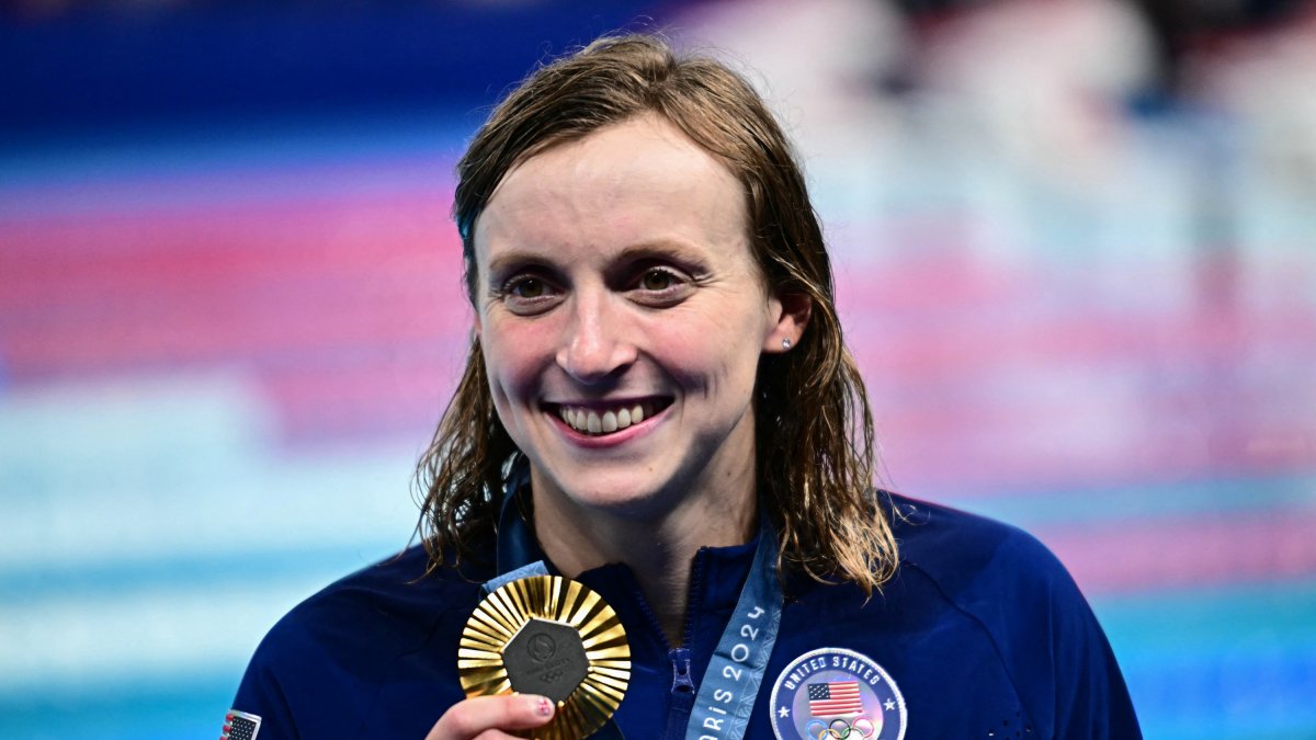 Katie Ledecky celebrates winning gold in the 800-meter freestyle at the 2024 Paris Olympics.